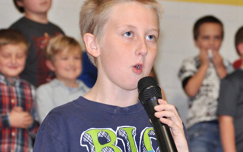 Isaiah Garland spoke before joining his classmates to sing a patriotic tune during East Fannin Elementary School’s veterans day program Wednesday, November 6.