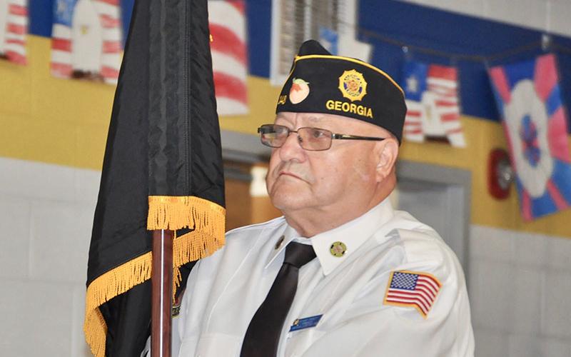 American Legion Post 248 Commander Richard Crosley carried the Missing in Action/Prisoner of War (POW/MIA) flag during East Fannin Elementary School’s veterans program.