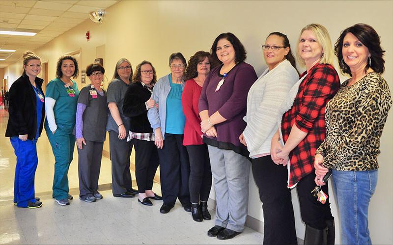 Fannin Regional Hospital Billing Specialist Mary Gage celebrated 43 years of service with her co-workers and friends during her retirement reception Friday, November 1. Shown are, from left, Holly Lowry, Tosha Brookshire, Cindy McDougal, Angie Herring, Judy Little, Gage, Karen VanZandt, Melissa Eaton, Cindy Watkins, Melissa Barker and Lisa Grindstaff.