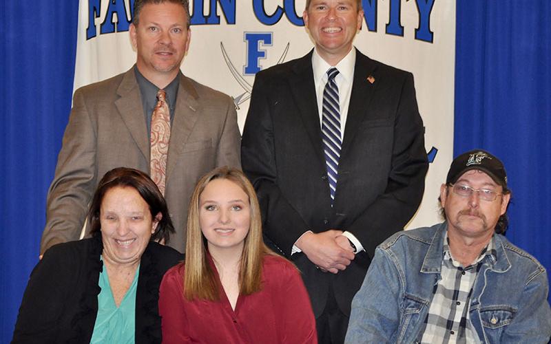 Fannin County Middle School student Amy Truett signed her REACH scholar contract with her family Tuesday, November 12. Shown are, from left, front, Amanda Little, Amy Truett and Brandon Truett; back, Fannin County High School Principal Erik Cioffi and Superintendent Dr. Michael Gwatney.