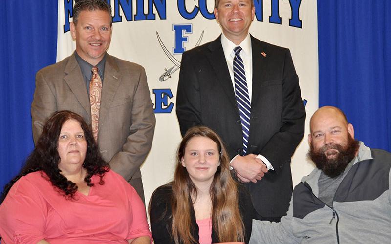 Fannin County Middle School student Alayna Dockery signed her REACH scholar contract with her family Tuesday, November 12. Shown are, from left, front, Heather Dockery, Alayna Dockery and Randy Monkus; back, Fannin County High School Principal Erik Cioffi and Superintendent Dr. Michael Gwatney.