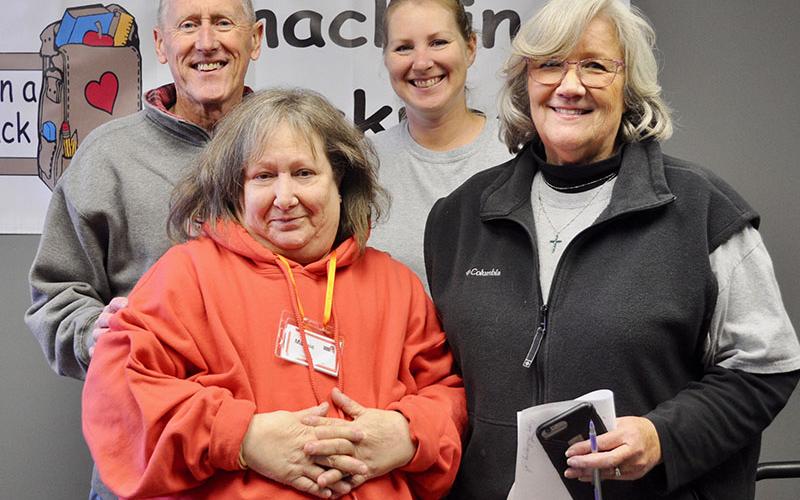 Snack in a Backpack volunteers packed their 20,000th meal of the 2019-2020 school year Wednesday, November 20. Shown are, from left, front, Margorie Dallas and Director Debby Beck; back, Mike Nunnally and Bethany Higgins.