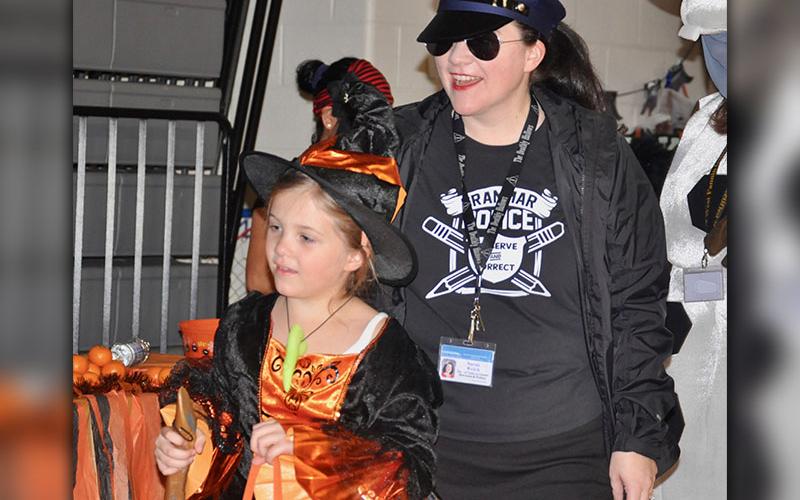 Fannin County School System Director of Instructional Services &amp; Policy Sarah Welch, also known as The Grammar Police, escorted her daughter, Addie Welch, at West Fannin Elementary School’s trick-or-treating event.