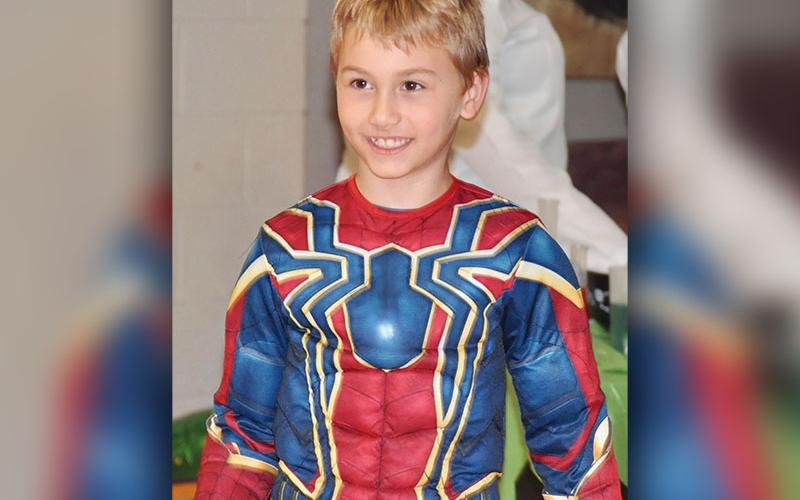 Spiderman reveals his secret identity, which is none other than West Fannin Elementary School student Connor Owens, at the school’s trick-or-treating event Thursday, October 31.