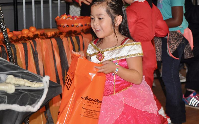 Hannah Carranza-Alvarez excitedly trick-or-treats during West Fannin Elementary School’s event Thursday, October 31.