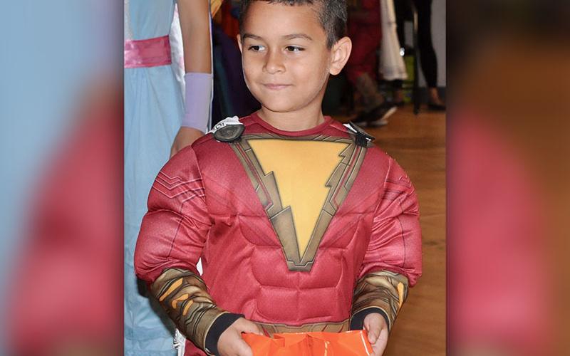 West Fannin Elementary School student Christopher Oler shouted “SHAZAM!,” before turning into the superhero at the school’s trick-or-treating event.