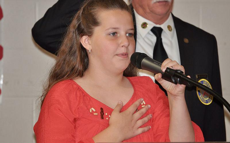 West Fannin Elementary School student Ruby Rhodes led the Pledge of Allegiance during the school’s veterans program.