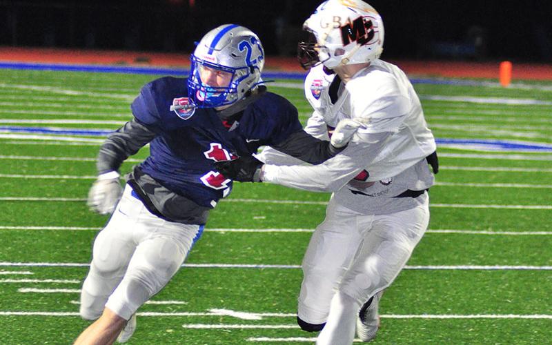 Fannin Rebel JoJo Goodwin tries to break free from a Tennessee defender to catch a pass during the Border War at FCHS Thursday, December 19.