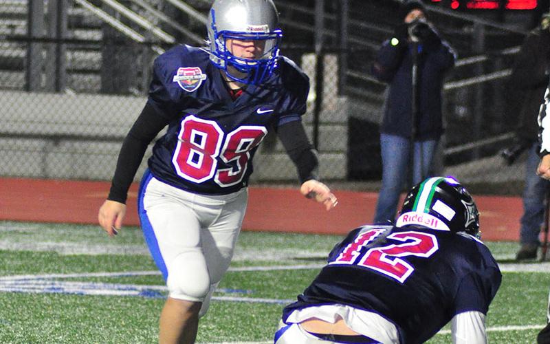 Lady Rebel Sarah Sosebee (89) lines up an extra point during the FCA’s Border War Thursday, December 19.