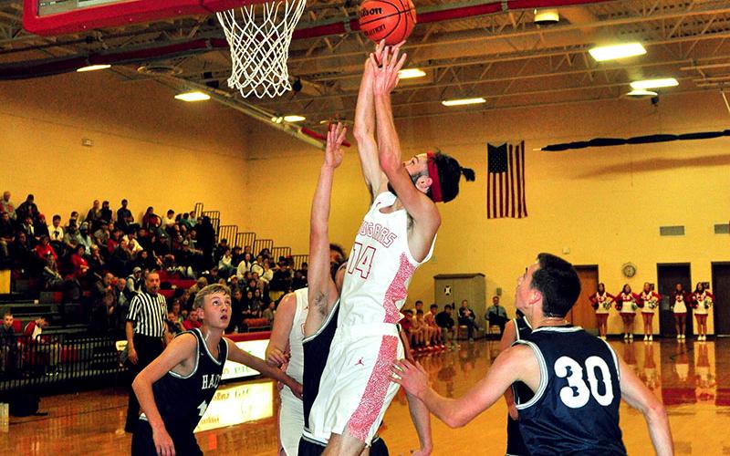 Copper Basin Cougar Logan Burkett muscles his way into the paint for a two-point jumper in recent action for the Cougars.