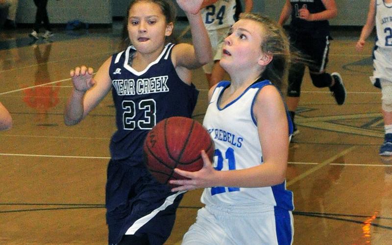 Seventh grade Lady Rebel Maddie Ledford goes up for a layup in recent action for Fannin County Middle School.