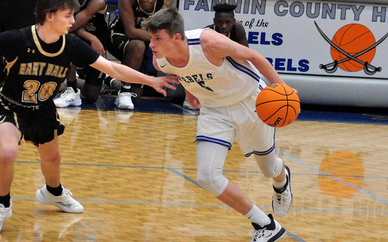 Fannin Rebel Kaeden Twiggs gets around an East Hall defender during the Rebels region game with East Hall Tuesday, December 17.
