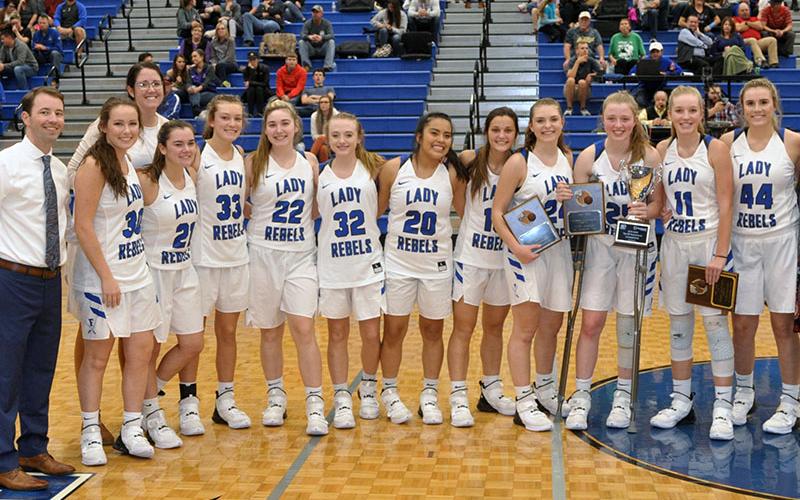 The Fannin County Lady Rebels beat Gilmer County 40-39 to win the ETC Classic basketball tournament Tuesday, November 26. Shown following thier victory are, from left, FCHS Lady Rebels head coach Ryan Chastain, Natalie Thomas, assistant coach Megan Queen, Jenna Young, Regan York, Paige Foresman, Mackenzie Johnson, Prisila Bautista, Becca Ledford, All Tournament Team winners Abby Ledford, Morgan Holt, Saidee Collins and Olivia Sisson.