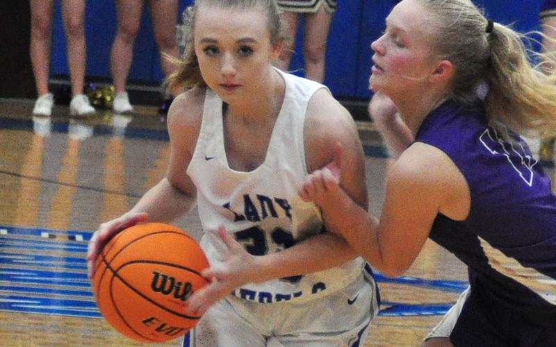 Lady Rebel Mackenzie Johnson uses her speed to get past a defender in recent action for the Fannin County Lady Rebels basketball team.
