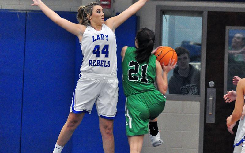 Lady Rebel Olivia Sisson goes up for a block in recent action for Fannin County High School.