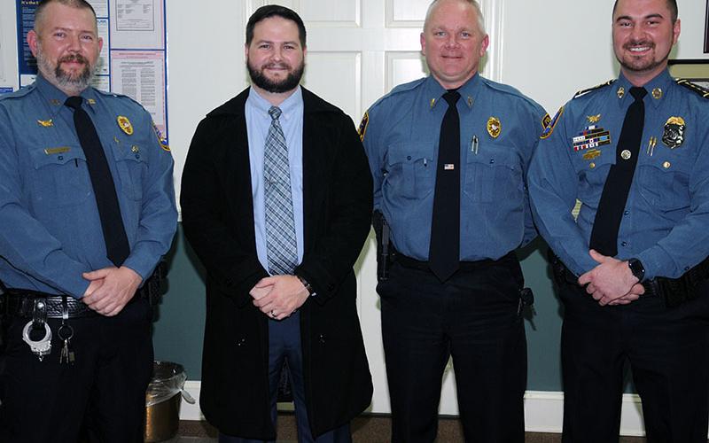 Medals of Valor were presented to McCaysville police officers, from left, Patrolman Cory Collogan, Sergeant Ken Higdon, Lieutenant Billy Brackett and Chief Michael Earley at the December 10 meeting of the city council.
