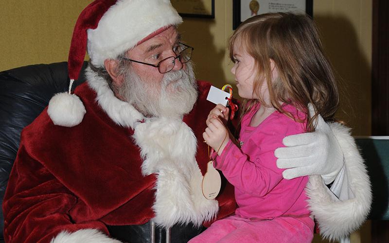 Trinity Jeans was happy to share her Christmas wish list with Santa when he came to the Copper Basin Community Center in Ducktown December 13. All the children who visited received a free toy, made Christmas ornaments and enjoyed other activities.