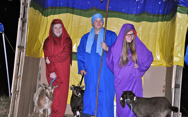 Blake Nicholson, Patrick Conner and Emilee Thomas depict the shepherds in the story of Jesus. The trio participated in Mt. Moriah Baptist Church’s Live Drive Through Nativity, The Road to Bethlehem.
