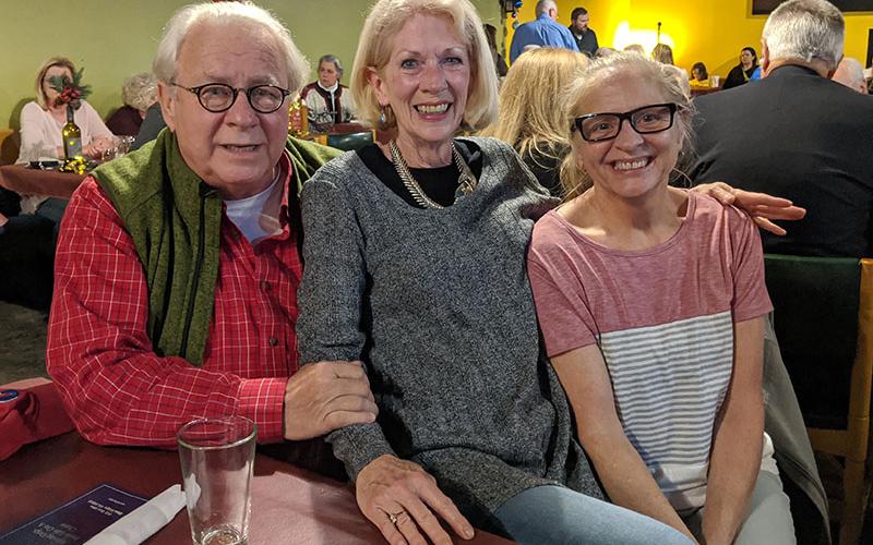 Dog advocates and Freedom for Fido volunteers Kirk Williams, Libby Young and Dana Worm have fun at the recent fundraiser for the new non-profit group that has, since April, already built fences for four families, freeing 10 dogs from lives of confinment.