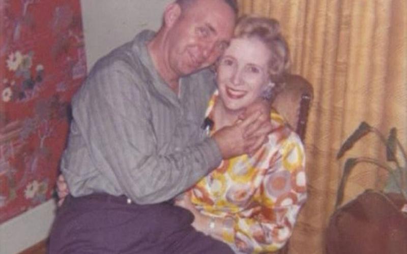 Blue Ridge’s Dale Dyer sits on the lap of his wife, Virginia.