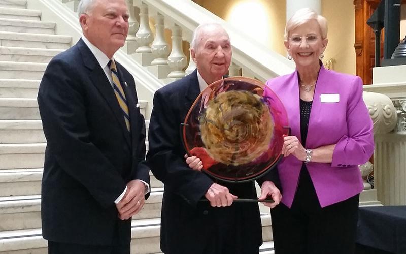 Blue Ridge’s Dale Dyer receives an award presented by then Governor Nathan Deal and the Georgia Council on Arts and Humanities for his involvement in writing the books “Facets of Fannin” and “Fannin County Cemeteries.” The award was also for being president of the Kiwanis Club and being a lifetime member of the Chamber of Commerce, according to sons Larry and Eric Dyer.