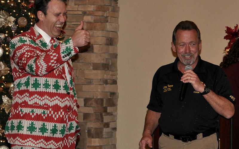 Chief Medical Officer Dr. Dillon Miller laughs with Fire Chief Larry Thomas during the annual EMA Banquet at Willow Creek Falls and Vineyard in Blue Ridge Thursday, December 12.