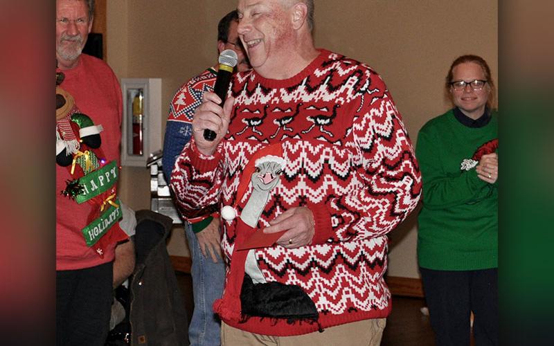 EMA Director Robert Graham insists that someone other than himself be awarded for wearing the “Ugliest” sweater.