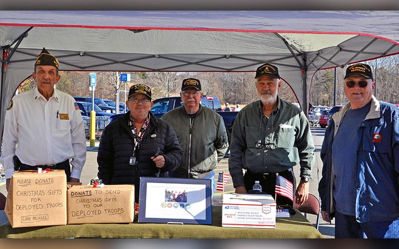 Local veterans, from left, Fannin County VFW Post 6570 Commander Richard Pierce, Charles Spivey, Rod McIntyre, Steve Strickland and Chuck Morris raise funds to send Christmas gifts to deployed troops Saturday, December 7.