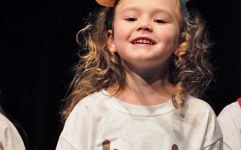 East Fannin Elementary School student Harper Newton excitedly performed the “Reindeer Hokey Pokey” with her fellow classmates during the school’s annual White Christmas program Thursday, December 19.