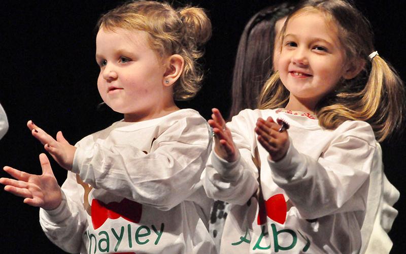 East Fannin Elementary School Pre-K students Shayley Greene and Abby Hood danced to “Santa Shark” during the school’s White Christmas program.