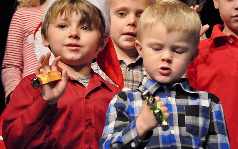 East Fannin Elementary School students Baine Allgary, left, and Landon Satterfield performed a jingle bell song at the school’s annual White Christmas program.
