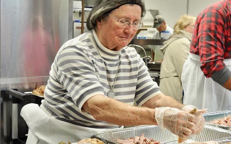 Good Samaritans of Fannin County volunteer Peggy Shaw prepared turkey for the organization’s Community Thanksgiving Open Table event.