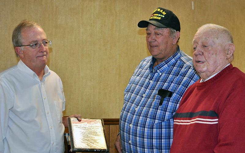 Tri-State EMC’s Operation Roundup, which makes donations to community causes from members rounding up of their electric bills, was honored at the Fannin County veterans organizations’ Christmas dinner for the program’s contribution to the Disabled American Veterans Chapter 28. Operation Roundup Chairman Glenn Harbison, left, accepted the award from Paul Hunter, center, and Joe Brandon.