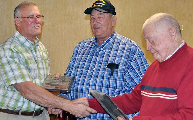 David Land, left, was honored at the Fannin County veterans organizations’ Christmas dinner Thursday, December 5 for volunteering his time to drive the Disabled American Vets van for community veterans. He is shown with Paul Hunter, middle, and Joe Brandon.