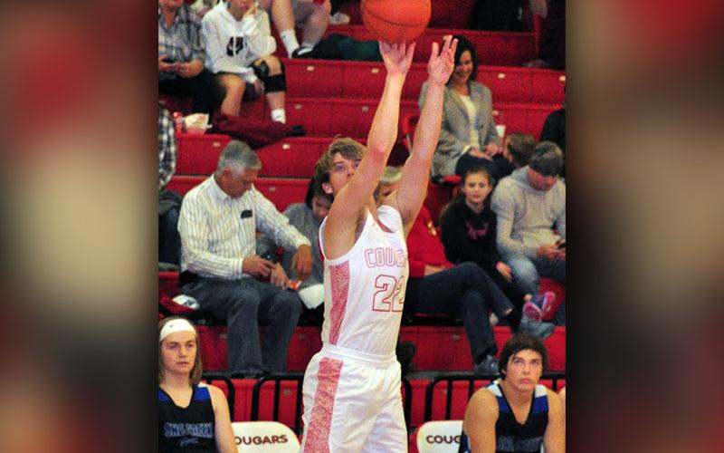 Copper Basin Cougar Nate Deal sinks a three-point basket during the Cougars district match with the Sale Creek Panthers Friday, January, 24.