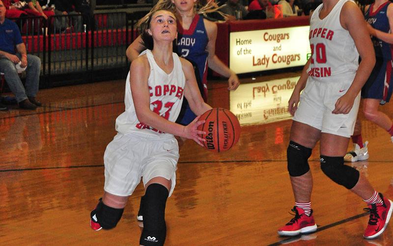 Lady Cougar Emily Hemming gathers for a lay-up in recent action for the Copper Basin Lady Cougars basketball team.