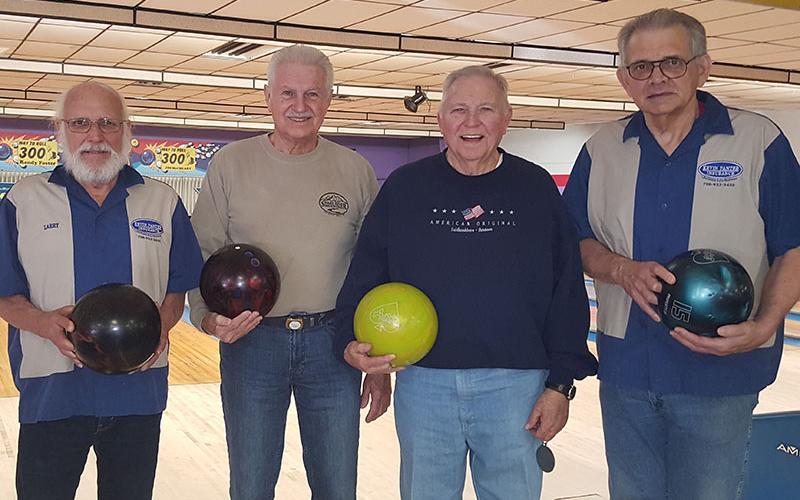 Golden Club Bowling League completed their Fall League, Wednesday, December 18, and at the banquet the following winners were declared: Handicap series, Bob Rodde with a 768 and Linda McKee with a 762; Handicap game, Larry Dumas with a 723 and Claudia Parks with a 300; Most improved bowler, Buddy Collins and Linda Beldowski; High Average, Chris McKee with a 202 and Bonna Graham with a 147. Shown are, from left, Dumas, Collins, Billy Acton and Rodde.
