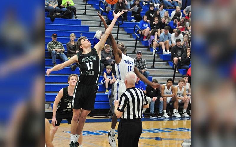Fannin Rebel Andre Bivens goes up for the tip during the Rebels basketball game with the North Hall Trojans Tuesday, January 14.