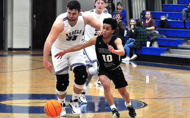 Fannin Rebel Miles Johnson steals the ball during the Rebels game with North Hall Tuesday, January 14.