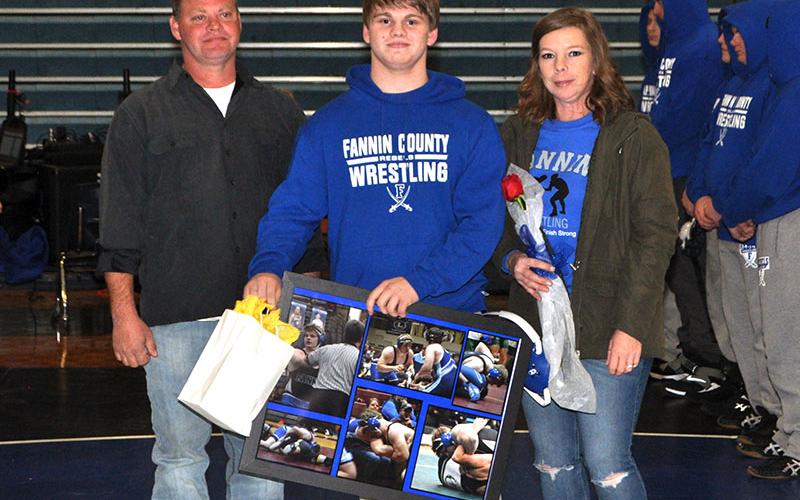 The Fannin County Rebels wrestling team honored eight seniors before the Rebels match up with the Union County Panthers Tuesday, January 21. Senior Levi Patton is shown with his parents Randy and Beth Patton.