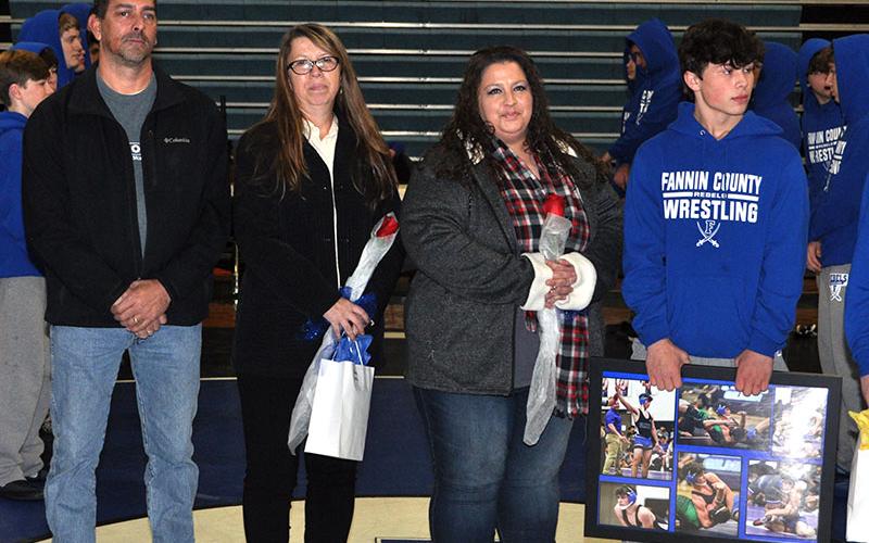 The Fannin County High School wrestling team honored eight seniors before their match against Union County Tuesday, January 21. Shown are, from left, Marcus Ponton, Carolyn Ponton, Tyechia Ledford and senior wrestler Patrick Welch.
