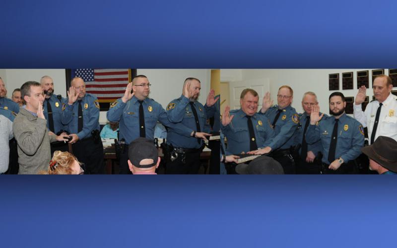 McCaysville Police Chief, far right, swore in the members of his department during the McCaysville City Council meeting Tuesday, January 14, as  these two photos show. Shown, from left, are Chaplain Michael Collis, Brian Collis, Philip Newberry, Chaplain Keith Ritchie, Gary Holloway, Ken Henderson, Robbie Rich, Cory Collogan, Pete Kusek, Tony Petty, Billy Brackett, Bill Higdon, and Assistant Chief Bill Cole.