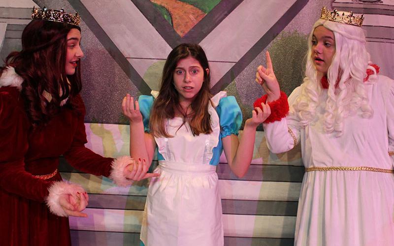 Go down the rabbit hole with the theater’s “Alice in Wonderland.” Here, Alice (Reece Lindstrom, center) stands between the feuding Red Queen (Kennedy Davies) and the White Queen (Kaitlyn Gilreath).