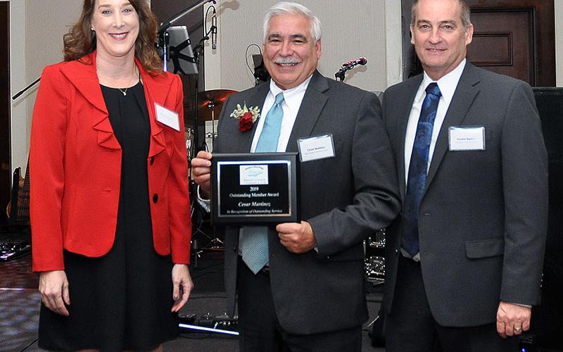 Businessman Cesar Martinez was awarded with the Outstanding Chamber Member plaque during the Fannin County Chamber of Commerce’s 36th Annual Banquet. Attorney Manda Gwatney and chamber Chairman Frankie Rigdon presented the award.
