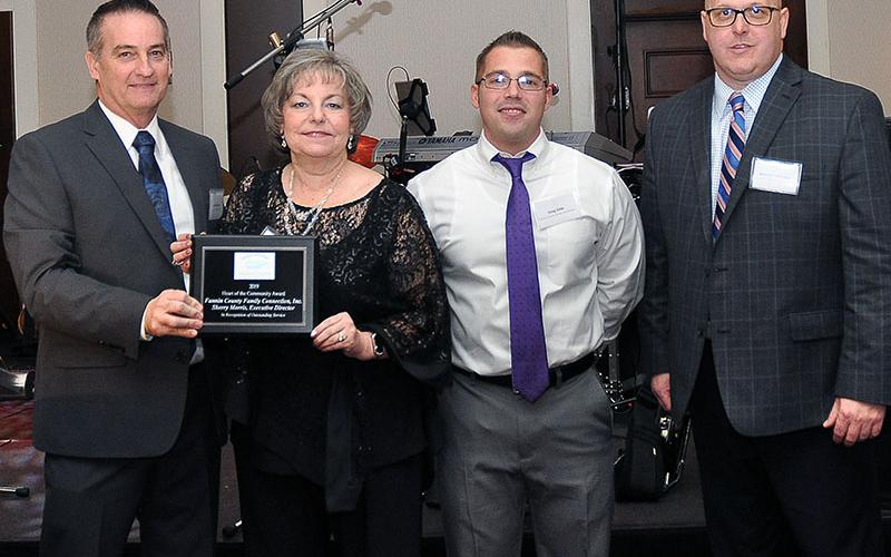 Fannin County Family Connection and its executive director, Sherry Morris, made history by earning the Chamber of Commerce’s first Heart of the Community Award. Shown are, from left, Chairman Frankie Rigdon, Morris, Family Connection Food Pantry Manager Greg Gelp and Chariman Elect Brandon Holloway.