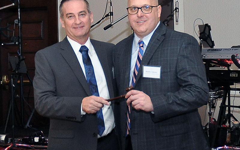 Fannin County Chamber of Commerce 2019 Chairman Frankie Rigdon passes the gavel to Chairman Elect Brandon Holloway, officially transfering the title of Chairman to Holloway for 2020.