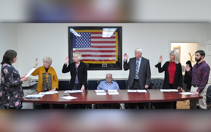 The City of McCaysville held a swearing in ceremony for the newly elected and  re-elected city officials. Shown are, from left, City Clerk Nancy Godfrey, re-elected councilwoman Sue Beaver, new councilwoman Gilita Carter, re-elected Mayor Thomas Seabolt, re-elected councilman Larry Collis, new councilwoman Susan Kiker and new councilman Jason Woody.
