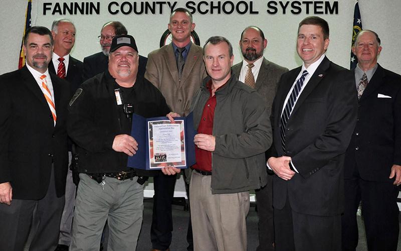 The Fannin County Board of Education recognized local law enforcement’s hard work and dedication to Fannin County schools for National Law Enforcement Appreciation Day Thursday, Janaury 9. Shown are, from left, front, Assistant Superintendent Darren Danner, School Resource Officer Tracy Summers, Sherriff Dane Kirby and Superintendent Dr. Michael Gwatney; back, board members Terry Bramlett, Lewis DeWesse, Chad Galloway, Mike Cole and Bobby Bearden.