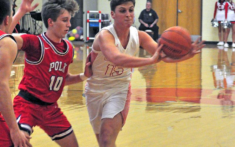 Copper Basin Cougar Tim Jabaley finds an open man during the Cougar’s game with in-county rival Polk County Tuesday, February 4.