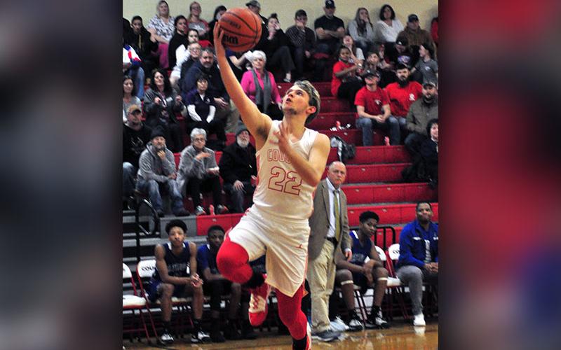 Copper Basin Cougar Nate Deal gets past a Patriot defender for a layup during the Cougars basketball game against CSAS Thursday, February 13.